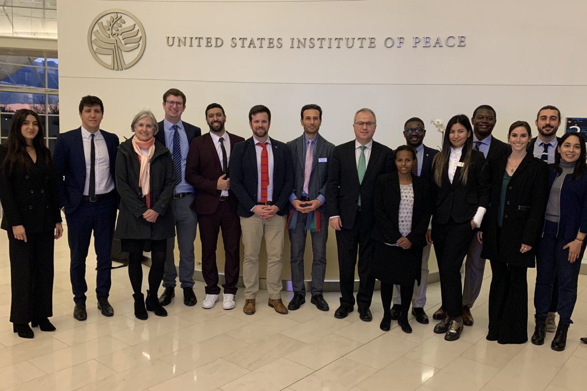 Rotary Peace Fellows standing in front of the United State Insitute of Peace sign.